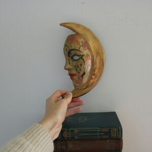 Vintage brass moon mask lady while hanging